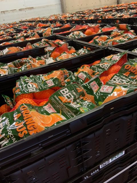 Oranges being packed while a fundraiser is organized by BENJI to help women that are violence victims - Beva Fruits International (BFI)